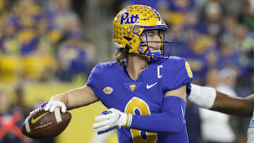 Nov 11, 2021; Pittsburgh, Pennsylvania, USA;  Pittsburgh Panthers quarterback Kenny Pickett (8) passes against the North Carolina Tar Heels during the first quarter at Heinz Field. Mandatory Credit: Charles LeClaire-Imagn Images