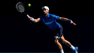Jan 24, 2025; Melbourne, Victoria, Australia; Novak Djokovic of Serbia hits a forehand during his match against Alexander Zverev of Germany in the semifinals of the men's singles at the 2025 Australian Open at Melbourne Park. Mandatory Credit: Mike Frey-Imagn Images