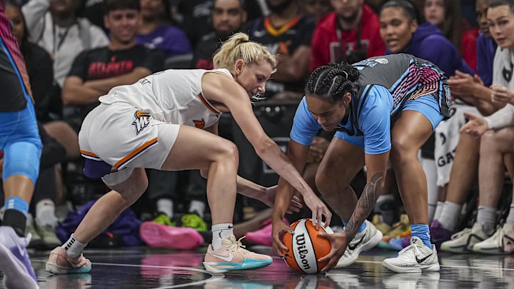 Aug 1, 2025; College Park, Georgia, USA; Phoenix Mercury guard Lexi Held (1) and Atlanta Dream guard Te-Hina Paopao (2) fight for the ball during the second half at Gateway Center Arena at College Park. Mandatory Credit: Dale Zanine-Imagn Images Aug 1, 2025; College Park, Georgia, USA; Phoenix Mercury guard Lexi Held (1) and Atlanta Dream guard Te-Hina Paopao (2) fight for the ball during the second half at Gateway Center Arena at College Park. Mandatory Credit: Dale Zanine-Imagn Images