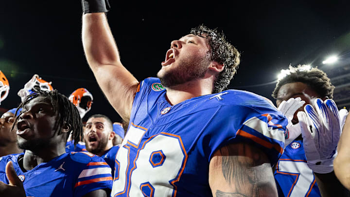Nov 16, 2024; Gainesville, Florida, USA; Florida Gators offensive lineman Austin Barber (58) cheers with Florida Gators running back Jadan Baugh (13) after a game against the LSU Tigers at Ben Hill Griffin Stadium. 