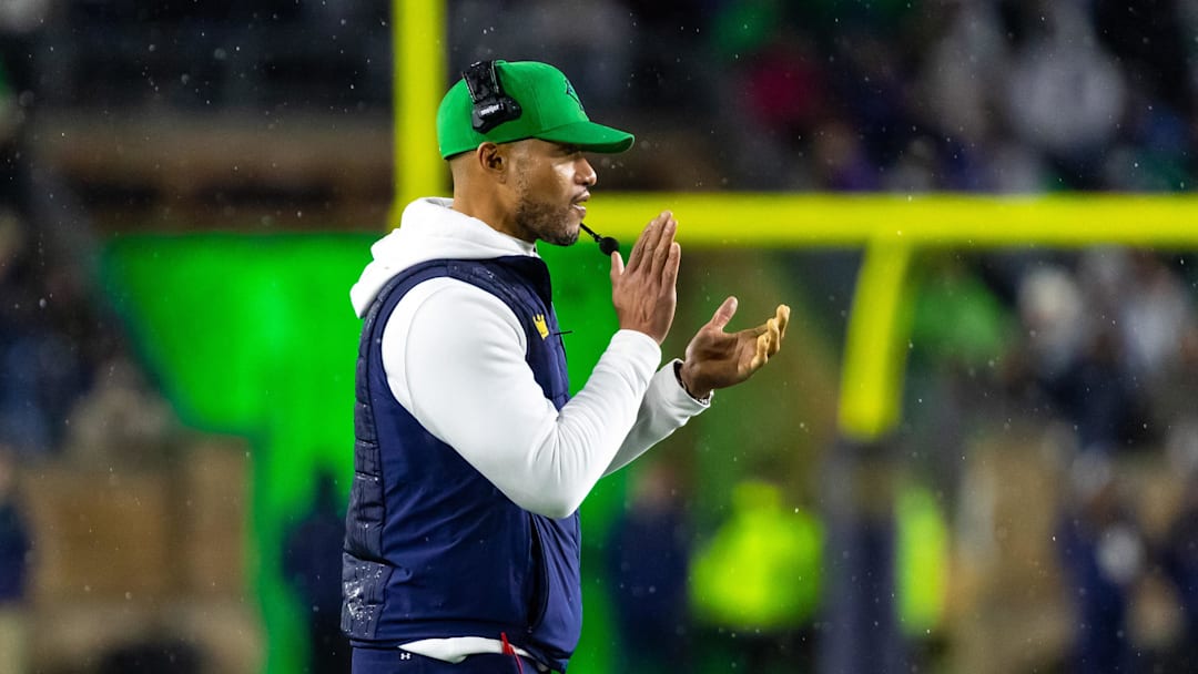 Notre Dame Fighting Irish head coach Marcus Freeman claps after scoring against the Navy Midshipmen