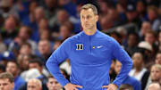 Nov 4, 2025; Charlotte, North Carolina, USA; Duke Blue Devils head coach Jon Scheyer watches the play against the Texas Longhorns during the first half of the Dick Vitale’s Invitational game at Spectrum Center. Mandatory Credit: Cory Knowlton-Imagn Images