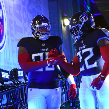 Nov 26, 2023; Nashville, Tennessee, USA; Tennessee Titans defensive tackle Jeffery Simmons (98) and running back Derrick Henry (22) walk to the field before the game against the Carolina Panthers at Nissan Stadium. Mandatory Credit: Christopher Hanewinckel-USA TODAY Sports