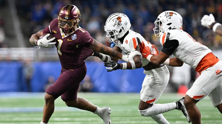 Minnesota running back Darius Taylor (1) runs the ball against Bowling Green in the first quarter at Ford Field in Detroit on Dec. 26, 2023.