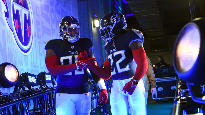 Nov 26, 2023; Nashville, Tennessee, USA; Tennessee Titans defensive tackle Jeffery Simmons (98) and running back Derrick Henry (22) walk to the field before the game against the Carolina Panthers at Nissan Stadium. Mandatory Credit: Christopher Hanewinckel-USA TODAY Sports