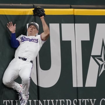 Jul 4, 2024; Arlington, Texas, USA; Texas Rangers outfielder Wyatt Langford (36) catches a fly ball during the second inning against the San Diego Padres at Globe Life Field. Mandatory Credit: Raymond Carlin III-USA TODAY Sports