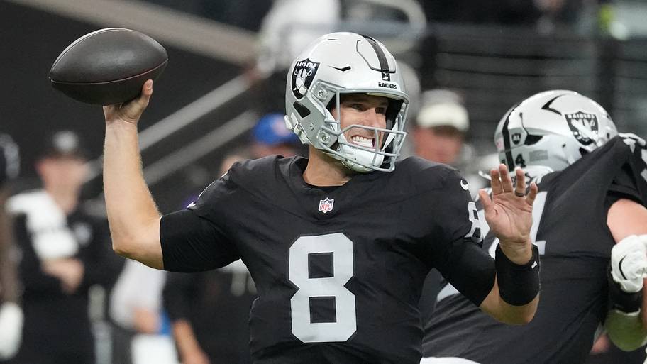 Kirk Cousins throws a pass in a Raiders preseason game.