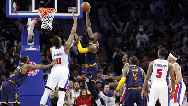 Apr 24, 2016; Auburn Hills, MI, USA; Cleveland Cavaliers forward LeBron James (23) takes a shot over Detroit Pistons center Andre Drummond (0) during the second quarter in game four of the first round of the NBA Playoffs at The Palace of Auburn Hills. Cavs win 100-98. Mandatory Credit: Raj Mehta-Imagn Images