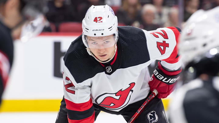 Apr 6, 2024; Ottawa, Ontario, CAN; New Jersey Devils center Curtis Lazar (42) lines up for a face off in the second period against the Ottawa Senators at the Canadian Tire Centre. Mandatory Credit: Marc DesRosiers-Imagn Images