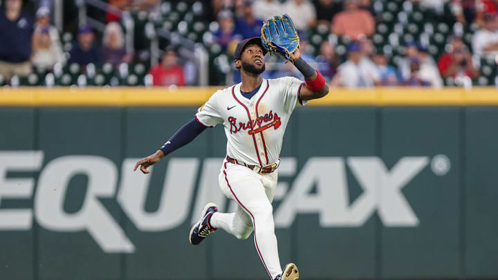 Sep 9, 2025; Cumberland, Georgia, USA; Atlanta Braves outfielder Jurickson Profar (7) runs to make a catch against the Chicago Cubs during the ninth inning at Truist Park. Mandatory Credit: Jordan Godfree-Imagn Images
