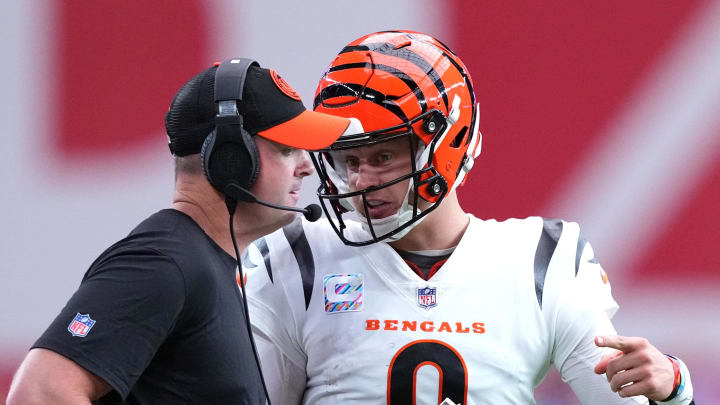 Oct 8, 2023; Glendale, Arizona, USA; Cincinnati Bengals head coach Zac Taylor and Cincinnati Bengals quarterback Joe Burrow (9) talk during the first half of the game against the Arizona Cardinals at State Farm Stadium. Mandatory Credit: Joe Camporeale-USA TODAY Sports