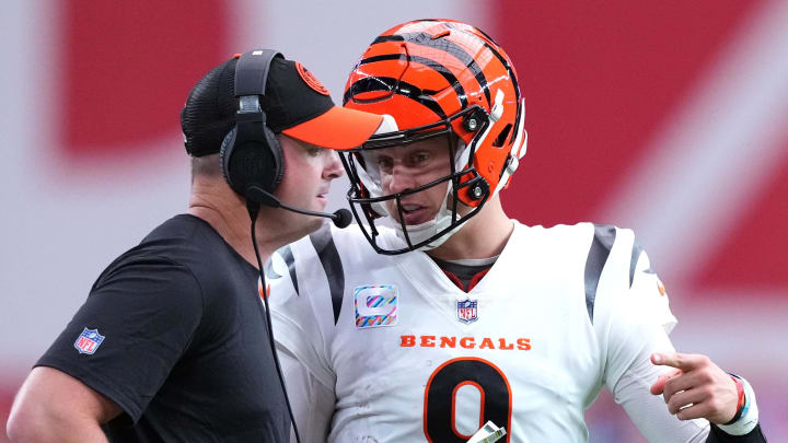 Oct 8, 2023; Glendale, Arizona, USA; Cincinnati Bengals head coach Zac Taylor and Cincinnati Bengals quarterback Joe Burrow (9) talk during the first half of the game against the Arizona Cardinals at State Farm Stadium. Mandatory Credit: Joe Camporeale-USA TODAY Sports