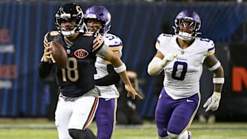 Chicago Bears quarterback Caleb Williams (18) rushes the ball against the Minnesota Vikings during the second half at Soldier Field.