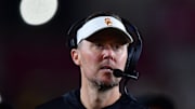 Nov 7, 2025; Los Angeles, California, USA; Southern California Trojans head coach Lincoln Riley watches game action against the Northwestern Wildcats during the second half at the Los Angeles Memorial Coliseum. Mandatory Credit: Gary A. Vasquez-Imagn Images
