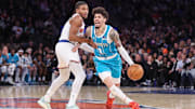 Dec 3, 2025; New York, New York, USA;  Charlotte Hornets guard LaMelo Ball (1) drives against New York Knicks guard Miles McBride (2) in the second quarter at Madison Square Garden. Mandatory Credit: Wendell Cruz-Imagn Images