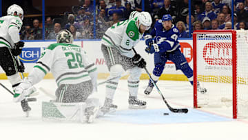 Dec 4, 2023; Tampa, Florida, USA; Dallas Stars defenseman Jani Hakanpaa (2) defends the puck against the Tampa Bay Lightning during the third period at Amalie Arena. Mandatory Credit: Kim Klement Neitzel-Imagn Images