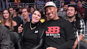 Lavar Ball and wife Tina wear Big Baller Brand apparel during an game between the Los Angeles Lakers and the Detroit Pistons.