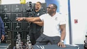 NFL Hall of Famer and former SSU football player Shannon Sharpe signing bottles of his Le Portier Shay VSOP Luxury Cognac.