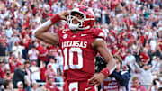 Arkansas Razorbacks quarterback Taylen Green (10) celebrates after scoring a touchdown in the second quarter against the Texas A&M Aggies at Donald W. Reynolds Razorback Stadium.
