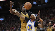 Mar 1, 2024; Toronto, Ontario, CAN; Toronto Raptors forward Chris Boucher (25) and Golden State Warriors guard Gary Payton II (0) battle for a rebound during the second half at Scotiabank Arena. Mandatory Credit: John E. Sokolowski-Imagn Images