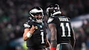 Nov 28, 2025; Philadelphia, Pennsylvania, USA; Philadelphia Eagles quarterback Jalen Hurts (1) and wide receiver A.J. Brown (11) celebrate their touchdown connection against the Chicago Bears at Lincoln Financial Field. Mandatory Credit: Bill Streicher-Imagn Images