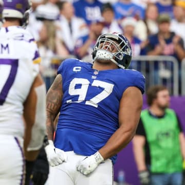 Dec 24, 2022; Minneapolis, Minnesota, USA; New York Giants defensive tackle Dexter Lawrence (97) celebrates a tackle against the Minnesota Vikings during the fourth quarter at U.S. Bank Stadium. Mandatory Credit: Matt Krohn-USA TODAY Sports