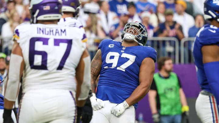 Dec 24, 2022; Minneapolis, Minnesota, USA; New York Giants defensive tackle Dexter Lawrence (97) celebrates a tackle against the Minnesota Vikings during the fourth quarter at U.S. Bank Stadium. Mandatory Credit: Matt Krohn-USA TODAY Sports