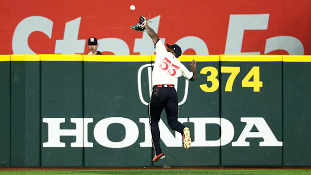 Texas Rangers right fielder Adolis Garcia makes a leaping catch during the seventh inning against the Philadelphia Phillies.