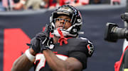 Nov 9, 2025; Houston, Texas, USA; Houston Texans running back Woody Marks (27) reacts after scoring a touchdown against the Jacksonville Jaguars during the first half at NRG Stadium.