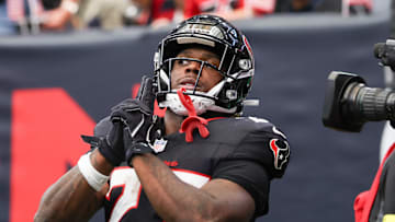 Nov 9, 2025; Houston, Texas, USA; Houston Texans running back Woody Marks (27) reacts after scoring a touchdown against the Jacksonville Jaguars during the first half at NRG Stadium.