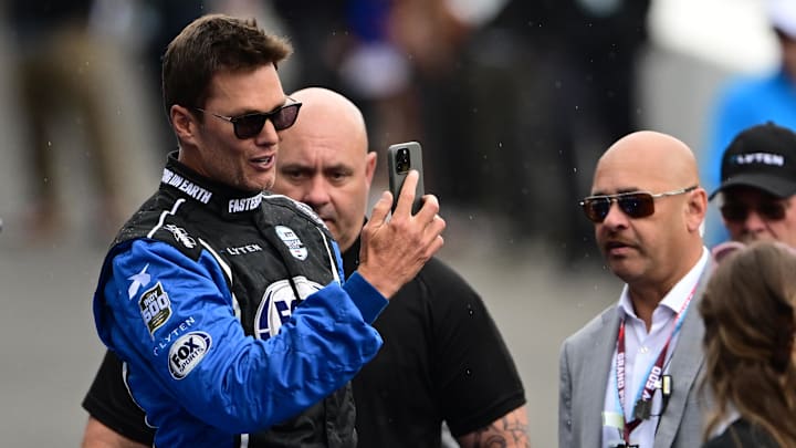 Tom Brady looks on before the 109th Running of the Indianapolis 500 at Indianapolis Motor Speedway. Tom Brady looks on before the 109th Running of the Indianapolis 500 at Indianapolis Motor Speedway.