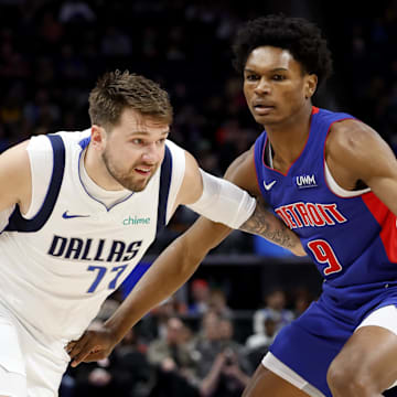 Mar 9, 2024; Detroit, Michigan, USA;  Dallas Mavericks guard Luka Doncic (77) dribbles against Detroit Pistons forward Ausar Thompson (9) in the first half at Little Caesars Arena. Mandatory Credit: Rick Osentoski-Imagn Images