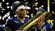 Jan 8, 2024; Houston, TX, USA; Michigan Wolverines defensive back Will Johnson (2) celebrates with the championship trophy after defeating the Washington Huskies during the 2024 College Football Playoff national championship game at NRG Stadium. Mandatory Credit: Mark J. Rebilas-USA TODAY Sports