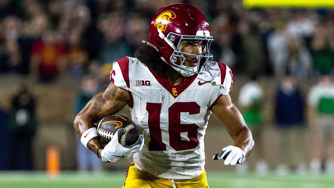 Oct 18, 2025; South Bend, Indiana, USA;  Southern California Trojans wide receiver Tanook Hines (16) runs the ball against the Notre Dame Fighting Irish during the first half  at Notre Dame Stadium. Mandatory Credit: Michael Caterina-Imagn Images