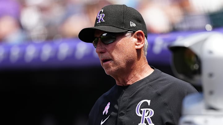 Colorado Rockies manager Bud Black sits in the dugout during a game.