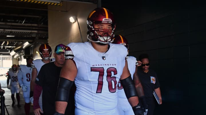 Oct 1, 2023; Philadelphia, Pennsylvania, USA; Washington Commanders offensive tackle Sam Cosmi (76) leads his team in the tunnel against the Philadelphia Eagles at Lincoln Financial Field. Mandatory Credit: Eric Hartline-USA TODAY Sports