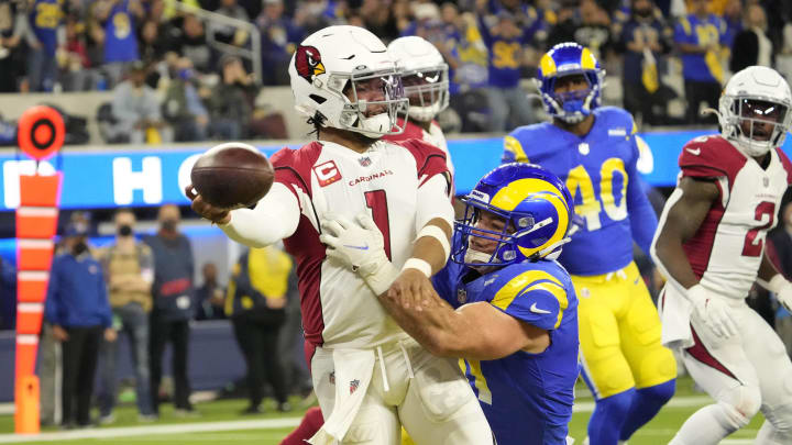 Jan 17, 2022; Los Angeles, California, USA;  Arizona Cardinals quarterback Kyler Murray (1) throws the ball while brought down by Los Angeles Rams linebacker Anthony Hines III (57) during the second quarter of the NFC Wild Card playoff game. The ball was intercepted for a touchdown.

Nfc Wild Card Playoff Cardinals Vs Rams