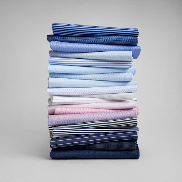 Multi-color polos stacked.