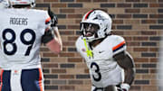 Nov 15, 2025; Durham, North Carolina, USA;  Virginia Cavaliers running back J'Mari Taylor (3) celebrates after scoring a touchdown during the third quarter against the Duke Blue Devils at Wallace Wade Stadium. Mandatory Credit: Zachary Taft-Imagn Images