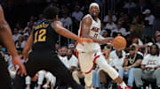 Apr 26, 2025; Miami, Florida, USA; Miami Heat center Bam Adebayo (13) drives to the basket against Cleveland Cavaliers forward De'Andre Hunter (12) in the third quarter during game three for the first round of the 2025 NBA Playoffs at Kaseya Center. Mandatory Credit: Sam Navarro-Imagn Images