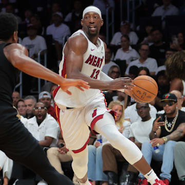 Apr 26, 2025; Miami, Florida, USA; Miami Heat center Bam Adebayo (13) drives to the basket against Cleveland Cavaliers forward De'Andre Hunter (12) in the third quarter during game three for the first round of the 2025 NBA Playoffs at Kaseya Center. Mandatory Credit: Sam Navarro-Imagn Images