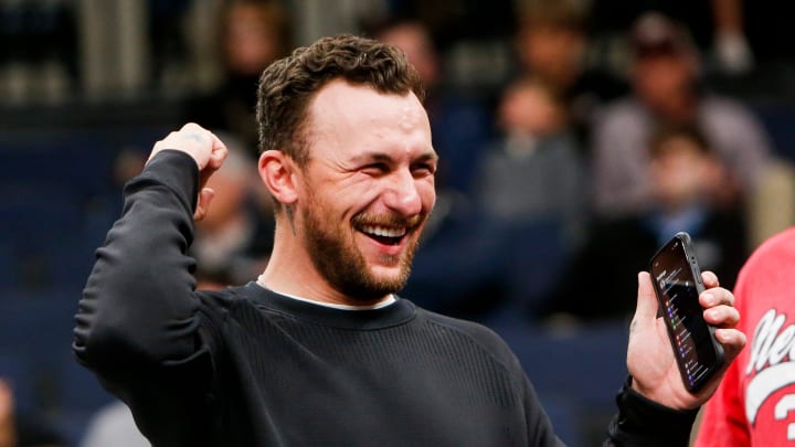 Former Texas A&M Heisman Trophy-winning quarterback Johnny Manziel cheers on the Aggies during the first round game between Texas A&M and Nebraska in the 2024 NCAA Tournament at FedExForum in Memphis, Tenn., on Friday, March 22, 2024.