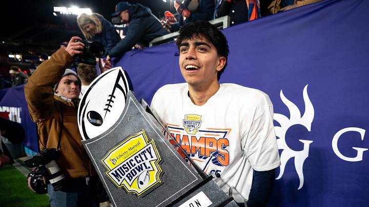 Illinois kicker David Olano (24) celebrates after defeating Tennessee the Liberty Mutual Music City Bowl at Nissan Stadium in Nashville, Tenn., Tuesday, Dec. 30, 2025.