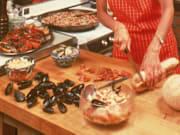 Aproned Woman In Kitchen