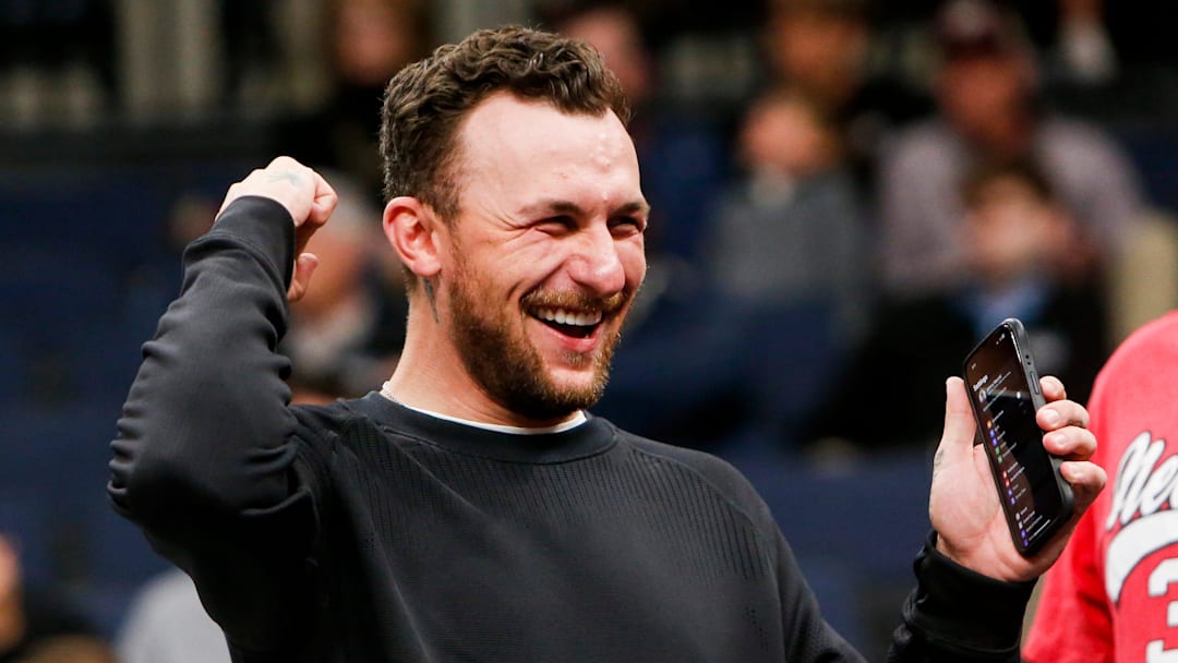 Former Texas A&M Heisman Trophy-winning quarterback Johnny Manziel cheers on the Aggies during the first round game between Texas A&M and Nebraska in the 2024 NCAA Tournament at FedExForum in Memphis, Tenn., on Friday, March 22, 2024.