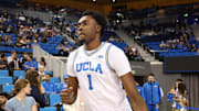 Nov 7, 2025; Los Angeles, California, USA;  UCLA Bruins center Xavier Booker (1) runs to the court prior to the game against the Pepperdine Waves at Pauley Pavilion presented by Wescom Financial. Mandatory Credit: Kiyoshi Mio-Imagn Images