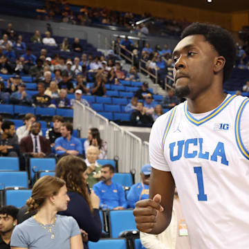 Nov 7, 2025; Los Angeles, California, USA;  UCLA Bruins center Xavier Booker (1) runs to the court prior to the game against the Pepperdine Waves at Pauley Pavilion presented by Wescom Financial. Mandatory Credit: Kiyoshi Mio-Imagn Images