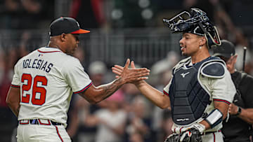 Sep 23, 2025; Cumberland, Georgia, USA; Atlanta Braves relief pitcher Raisel Iglesias (26)  reacts with catcher Drake Baldwin (30) after the Braves defeated the Washington Nationals at Truist Park. Mandatory Credit: Dale Zanine-Imagn Images