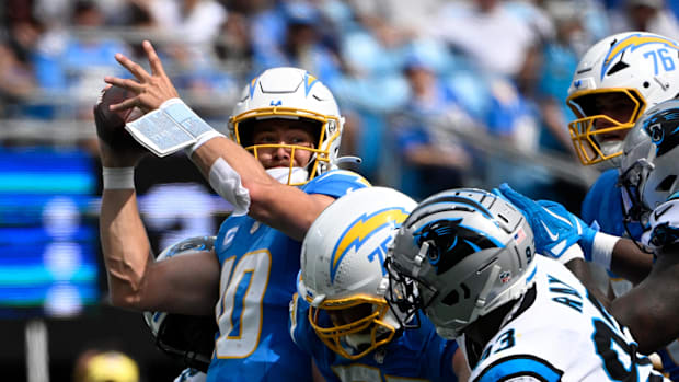 Sep 15, 2024; Charlotte, North Carolina, USA; Los Angeles Chargers quarterback Justin Herbert (10) tries to pass as Carolina 