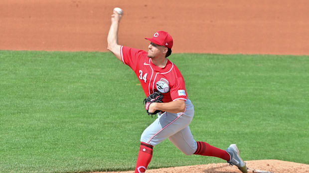 Cincinnati Reds starting pitcher Connor Phillips (34) throws in the fourth inning 